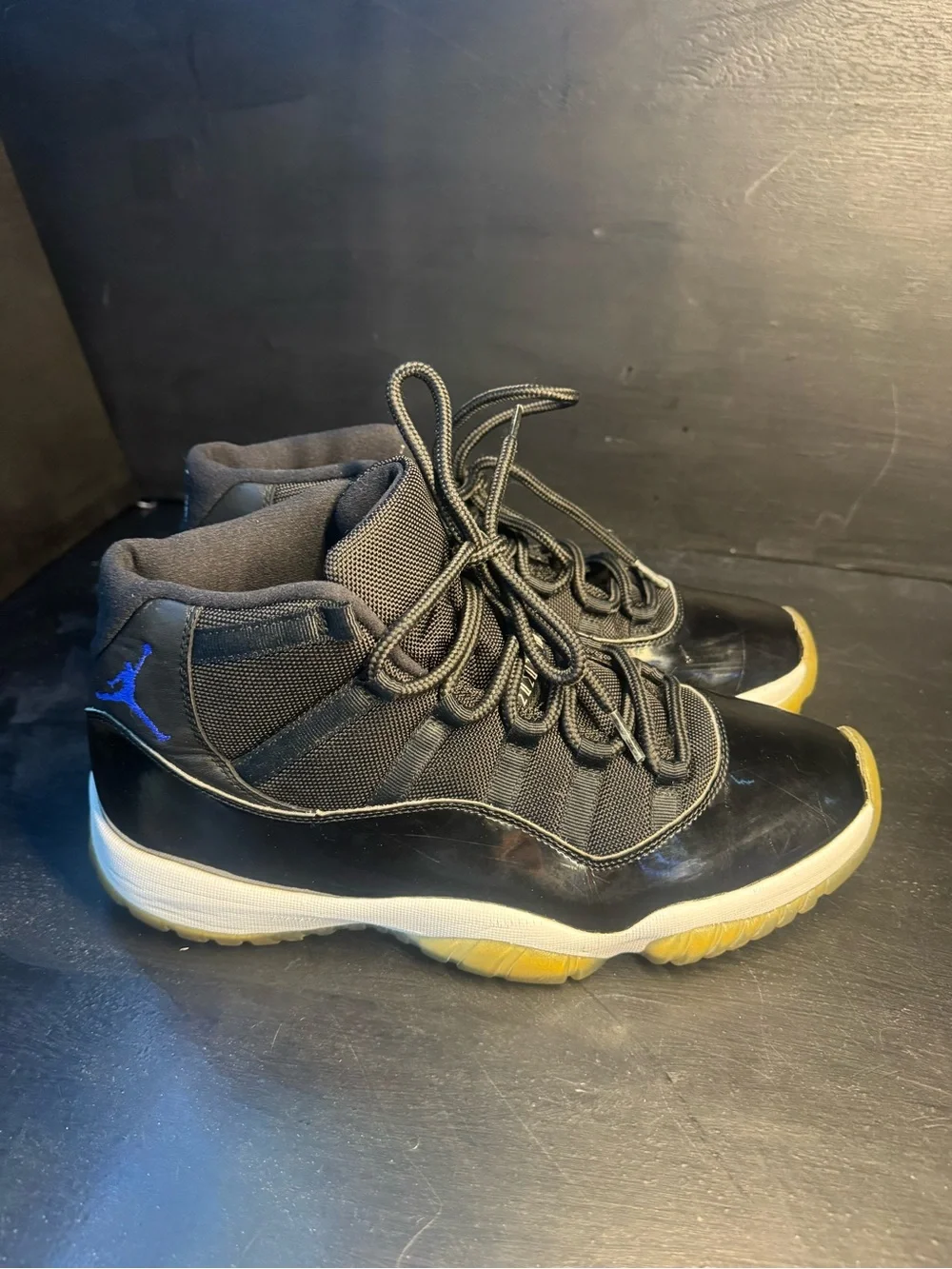 Jordan 11 Men’s Black Sneakers with Blue Jumpman